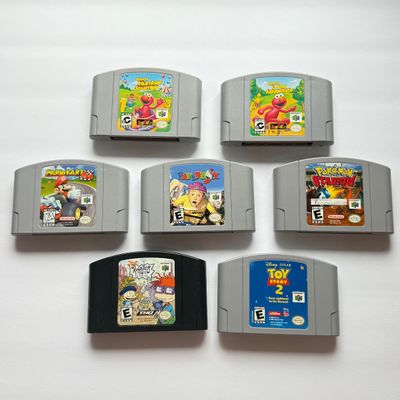 LOT 201V: Vintage Nintendo N64 Video Game Cartridges: Pokémon Stadium, Mario Kart 64, Paper Boy, Toy Story 2, Rugrats in Paris & Elmo...