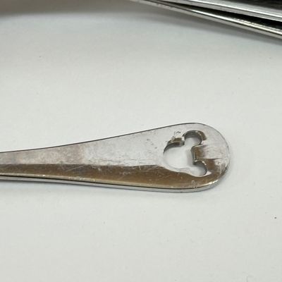 LOT 75A: Disney Mickey & Minnie Mouse Red Mugs (4) & Stainless Steel Mickey Cutout Flatware: 11 Butter Knives, 12 Tablespoons...
