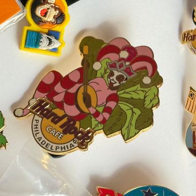 LOT 178J: Collectible Pins: Outback, Universal Studios, Hard Rock Cafe & More