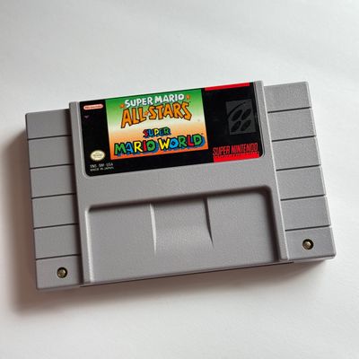 LOT 206V: Vintage Super Nintendo Video Game Cartridges: Super Mario All Stars / Super Mario World, Frogger, Paperboy & Yoshi's...