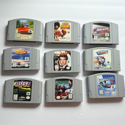 LOT 205V: Vintage Nintendo N64 Video Game Consoles: 007, Wayne Gretzky & More