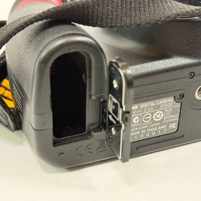 LOT 69A: Nikon D3100 Camera Body w/ Mod Camera Strap (NO BATTERY)