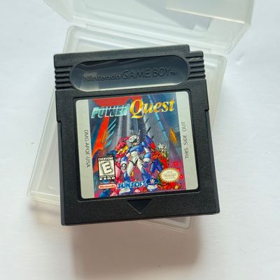 LOT 203V: Vintage Nintendo GameBoy Games & Accessories: Tamagotchi, Wayne's World, Power Quest, N64 Adapter & Clip-on Lighting