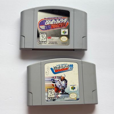 LOT 205V: Vintage Nintendo N64 Video Game Consoles: 007, Wayne Gretzky & More