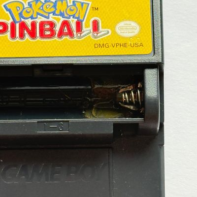 LOT 203V: Vintage Nintendo GameBoy Games & Accessories: Tamagotchi, Wayne's World, Power Quest, N64 Adapter & Clip-on Lighting