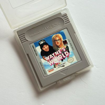 LOT 203V: Vintage Nintendo GameBoy Games & Accessories: Tamagotchi, Wayne's World, Power Quest, N64 Adapter & Clip-on Lighting
