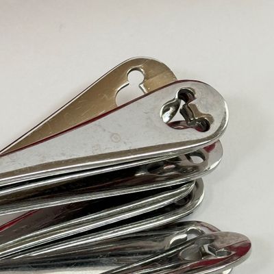 LOT 75A: Disney Mickey & Minnie Mouse Red Mugs (4) & Stainless Steel Mickey Cutout Flatware: 11 Butter Knives, 12 Tablespoons...