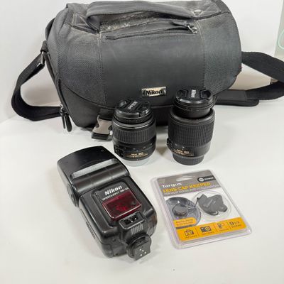 LOT 70A: Nikon Speedlight SB-25 External Flash, Nikon DX Lenses: 18-55mm & 55-200mm, Nikon Camera Bag & More