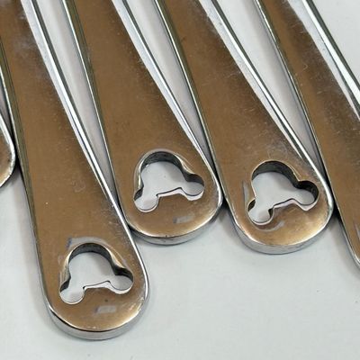 LOT 75A: Disney Mickey & Minnie Mouse Red Mugs (4) & Stainless Steel Mickey Cutout Flatware: 11 Butter Knives, 12 Tablespoons...