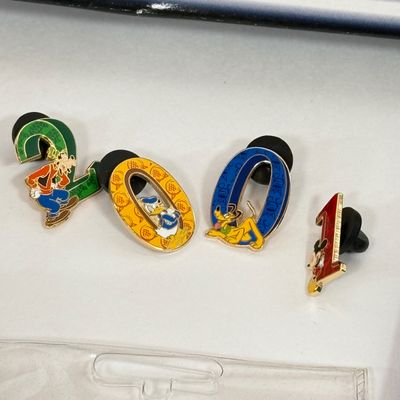 LOT 74P: Walt Disney World 2001 Collection: NIP Matchbox Bus, 2 0 0 1 Trading Pins (2 sets), Lanyards, Disc Ornament & Medallion