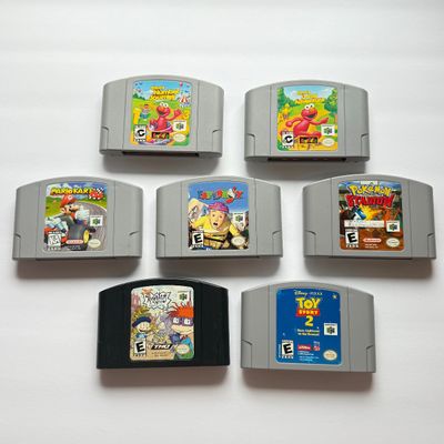 LOT 201V: Vintage Nintendo N64 Video Game Cartridges: Pokémon Stadium, Mario Kart 64, Paper Boy, Toy Story 2, Rugrats in Paris & Elmo...