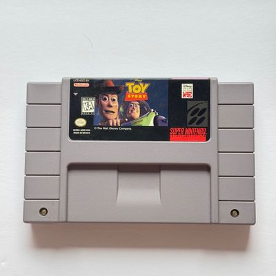 LOT 202V: Vintage Super Nintendo Video Game Cartridges: Tetris & Dr Mario, Donkey Kong Country 2 & Disney's Toy Story