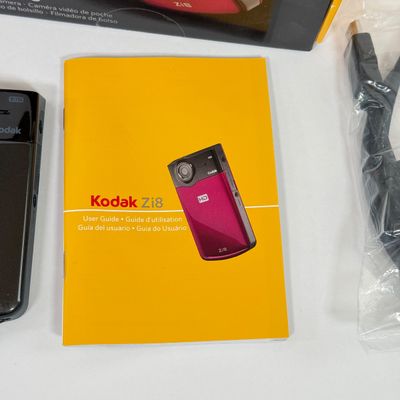 LOT 71A: Kodak Zi8 Pocket Video Camera w Box, Manuals, Charger & Cords