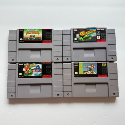 LOT 206V: Vintage Super Nintendo Video Game Cartridges: Super Mario All Stars / Super Mario World, Frogger, Paperboy & Yoshi's...