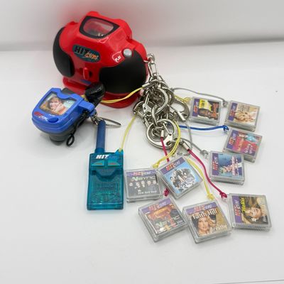 LOT 210V: Vintage Y2K Hit Clips: 2 Different Players, Radio Adapter & 10 Cartridges