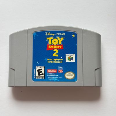 LOT 201V: Vintage Nintendo N64 Video Game Cartridges: Pokémon Stadium, Mario Kart 64, Paper Boy, Toy Story 2, Rugrats in Paris & Elmo...