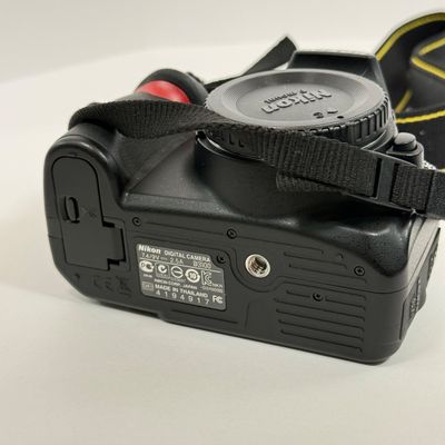 LOT 69A: Nikon D3100 Camera Body w/ Mod Camera Strap (NO BATTERY)