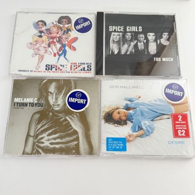 LOT 88A: Spice Up Your Life! Spice Girls Collection: Tapes, CDs, Toy Figures, Spice World Tour Book & Mini Pocket Baby Spice Books