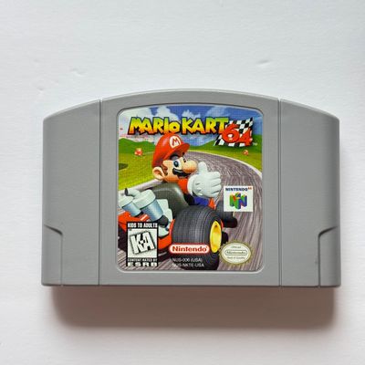 LOT 201V: Vintage Nintendo N64 Video Game Cartridges: Pokémon Stadium, Mario Kart 64, Paper Boy, Toy Story 2, Rugrats in Paris & Elmo...