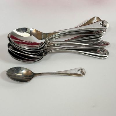 LOT 75A: Disney Mickey & Minnie Mouse Red Mugs (4) & Stainless Steel Mickey Cutout Flatware: 11 Butter Knives, 12 Tablespoons...