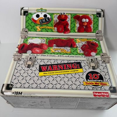 LOT 64A: NIB Sesame Street TMX Tickle Me Elmo 10th Anniversary Toy & TMX Tickle Me Elmo Barbie NRFB