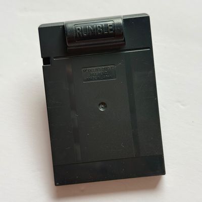 LOT 203V: Vintage Nintendo GameBoy Games & Accessories: Tamagotchi, Wayne's World, Power Quest, N64 Adapter & Clip-on Lighting