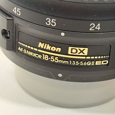 LOT 70A: Nikon Speedlight SB-25 External Flash, Nikon DX Lenses: 18-55mm & 55-200mm, Nikon Camera Bag & More