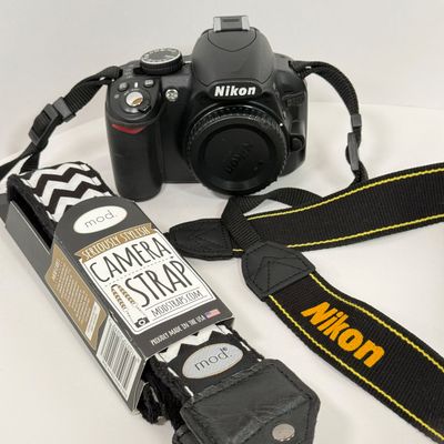 LOT 69A: Nikon D3100 Camera Body w/ Mod Camera Strap (NO BATTERY)