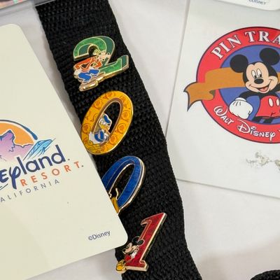 LOT 74P: Walt Disney World 2001 Collection: NIP Matchbox Bus, 2 0 0 1 Trading Pins (2 sets), Lanyards, Disc Ornament & Medallion