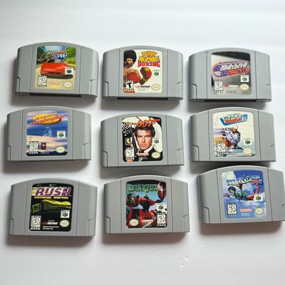 LOT 205V: Vintage Nintendo N64 Video Game Consoles: 007, Wayne Gretzky & More