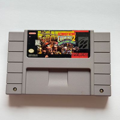 LOT 202V: Vintage Super Nintendo Video Game Cartridges: Tetris & Dr Mario, Donkey Kong Country 2 & Disney's Toy Story