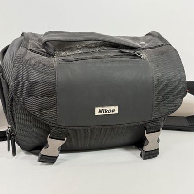 LOT 70A: Nikon Speedlight SB-25 External Flash, Nikon DX Lenses: 18-55mm & 55-200mm, Nikon Camera Bag & More