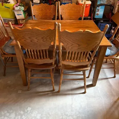 Dining table and six matching spindle-back chairs.