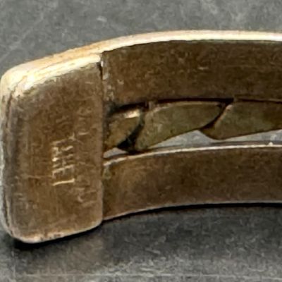 Sale Photo Thumbnail #231: This set includes a cuff bracelet and a pair of earrings. Each piece features gold-filled accents. Each is marked “925, 1/20 GF.” The cuff measures 2.25” wide. The total weight is 23.79 grams. [AG]