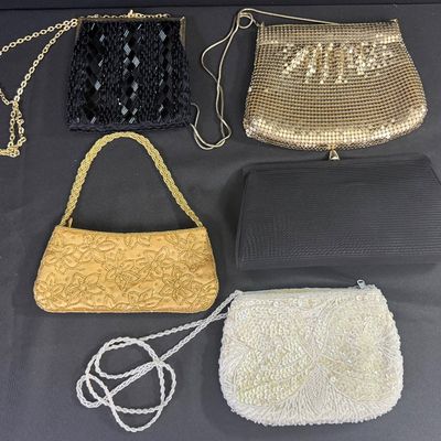 Sale Photo Thumbnail #96: Includes metal mesh, beads, sequins, and more. One bag has a matching coin purse. Total of six pieces. There is age related wear, including some staining on the interior of two of the bags. The largest measures approximately 10” x 5.5”. [CS]