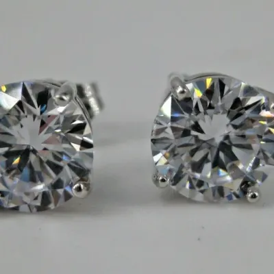 Sale Photo Thumbnail #4: Sterling Silver Earrings Round 7mm Cubic Zirconia Stud Butterfly Fastening 3/8" 
Weighs 2.4 g / 1.5 dwt 
Earrings Measure: 3/8" in diameter
Clear CZ stones: round, faceted, prong-set: 7mm in diameter each
Closure: Butterfly Fastening 
Hallmarks: CZ 925 
C