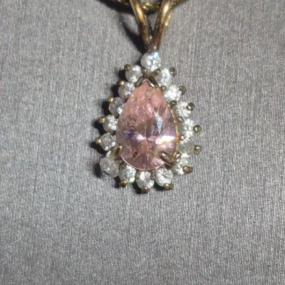 Sale Photo Thumbnail #41: Beautiful 1.5 carat Amethyst gold tone Necklace & Amethyst Rhinestone Earrings
> herringbone chain necklace....12"long
> Amethyst pendant .75" dangle
> Amethyst earring are clip style.