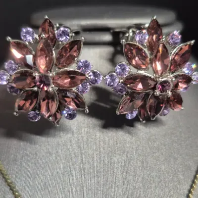 Sale Photo Thumbnail #43: Beautiful 1.5 carat Amethyst gold tone Necklace & Amethyst Rhinestone Earrings
> herringbone chain necklace....12"long
> Amethyst pendant .75" dangle
> Amethyst earring are clip style.