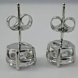 Sale Photo Thumbnail #3: Sterling Silver Earrings Round 7mm Cubic Zirconia Stud Butterfly Fastening 3/8" 
Weighs 2.4 g / 1.5 dwt 
Earrings Measure: 3/8" in diameter
Clear CZ stones: round, faceted, prong-set: 7mm in diameter each
Closure: Butterfly Fastening 
Hallmarks: CZ 925 
C