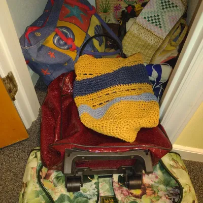 Contents of Closet- Linens, Pillows, Tote Bags, Heating Pad, Duffle Bag, Small Rolling Luggage, etc.