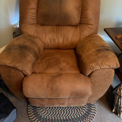 Sale Photo Thumbnail #283: Manual recliner in good working condition with heavy wear. Many stains, pleather.