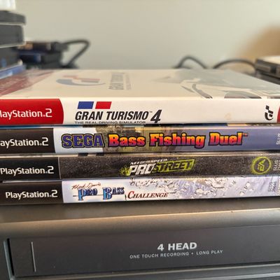 Sale Photo Thumbnail #330: Lot of 4 PS2 games all in original cases.