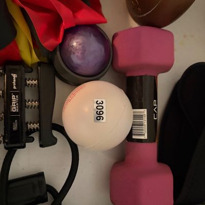 Sale Photo Thumbnail #321: This lot includes hand weights, dumbbells, hand strength grips, stretching bands, and medical wraps.