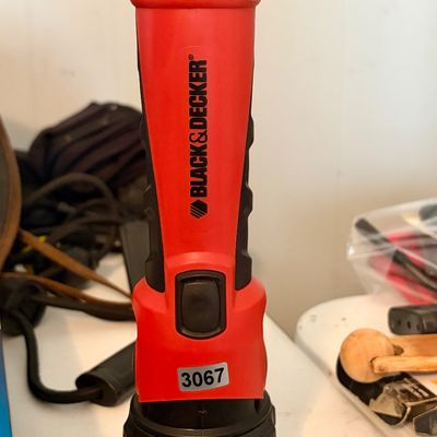 Sale Photo Thumbnail #393: Black and Decker Portable flashlight with battery pack.