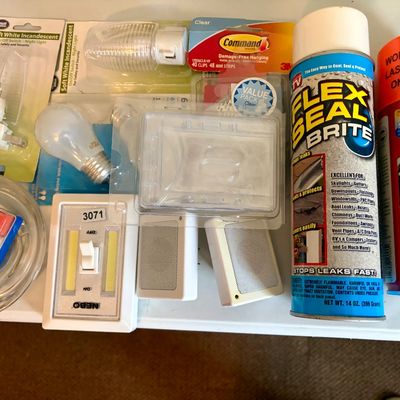Sale Photo Thumbnail #382: Lot contains many useful household items including light bulbs, nightlights, cans of sealants, etc.