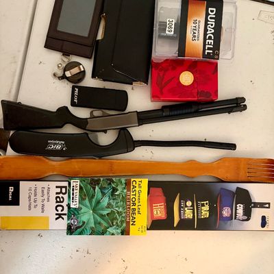 Sale Photo Thumbnail #379: Lot of miscellaneous items including a baseball cap rack, lighters, phone case, back scratcher, etc.