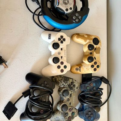 Sale Photo Thumbnail #402: This lot includes 6 video game controllers. All in used condition.
