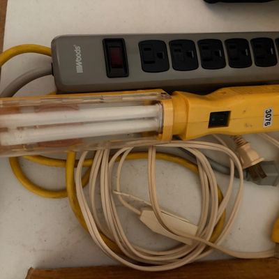 Sale Photo Thumbnail #319: Lot of 2 items including one IIIWoods power strip and a yellow florescent lamp.