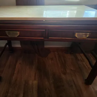 Sale Photo Thumbnail #28: This desk constricted with solid wood.  Marble top is broke into two pieces and is not fastened to the desk.
Selling as is