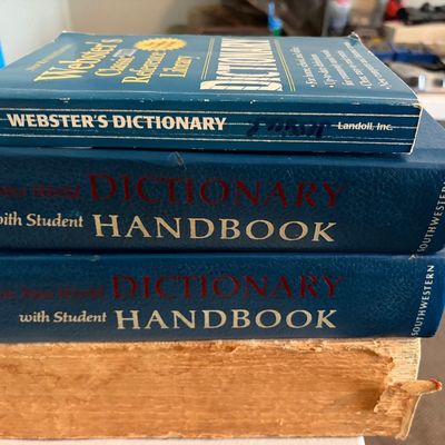 Sale Photo Thumbnail #312: Lot of 4 Webster dictionaries. Including one that is older and three newer student versions.